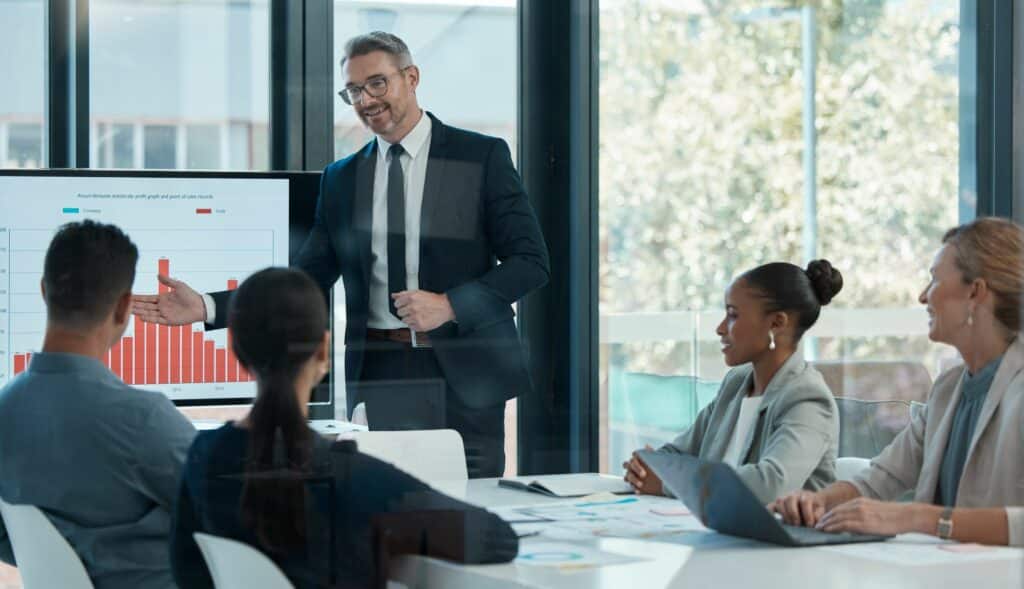 A business man directing  a meeting