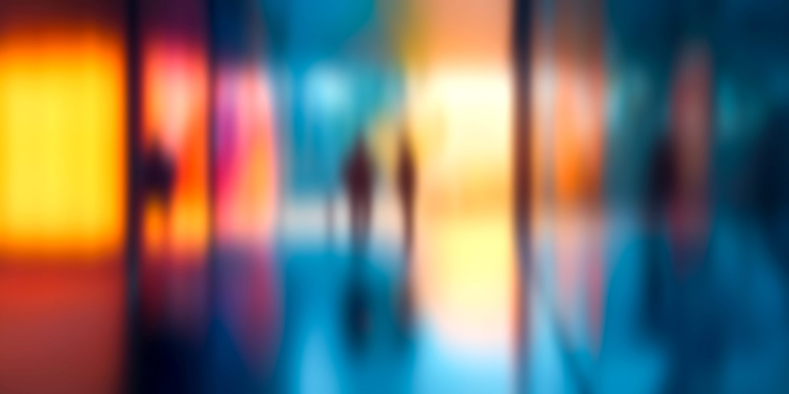 Blurred people of different demographics in abstract gradient colours