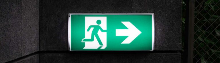 glowing green exit sign