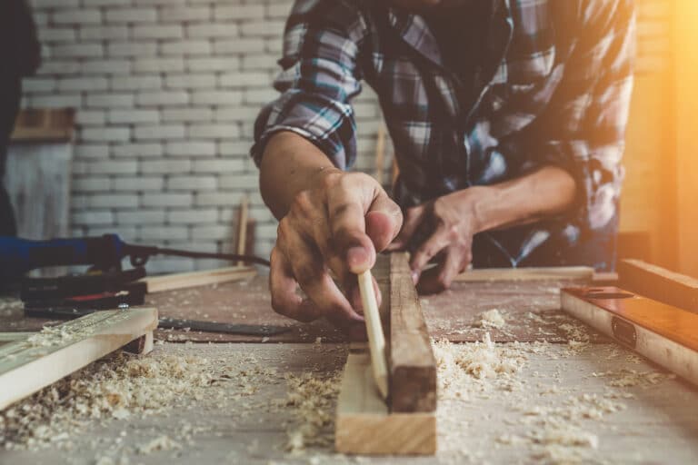 carpenter working on wood in a workshop