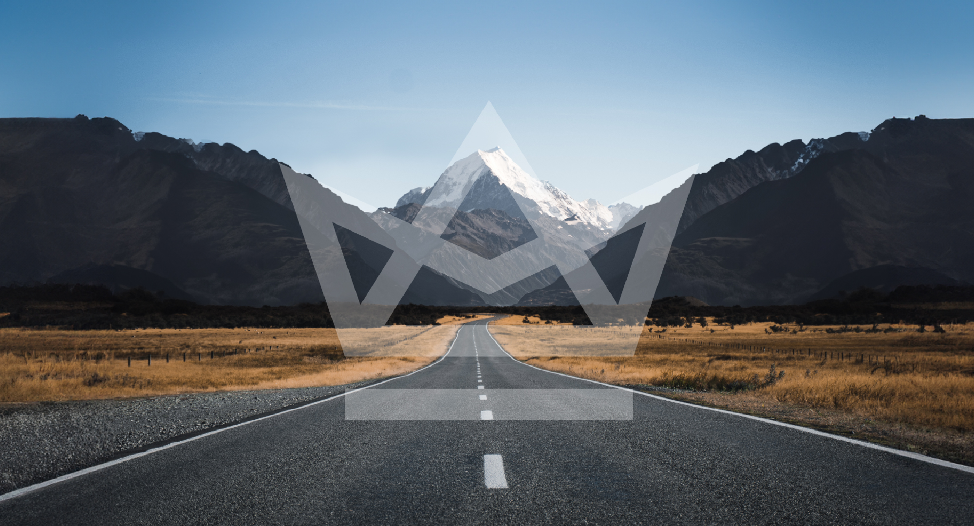 An open road with Hill's and a mountain in the background with the camperking logo covering it