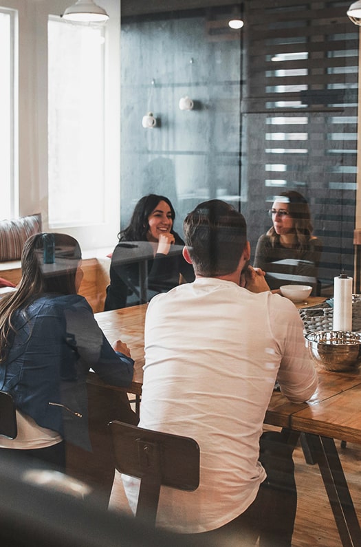 group of young business people in casual dress sitting in a strategy meeting