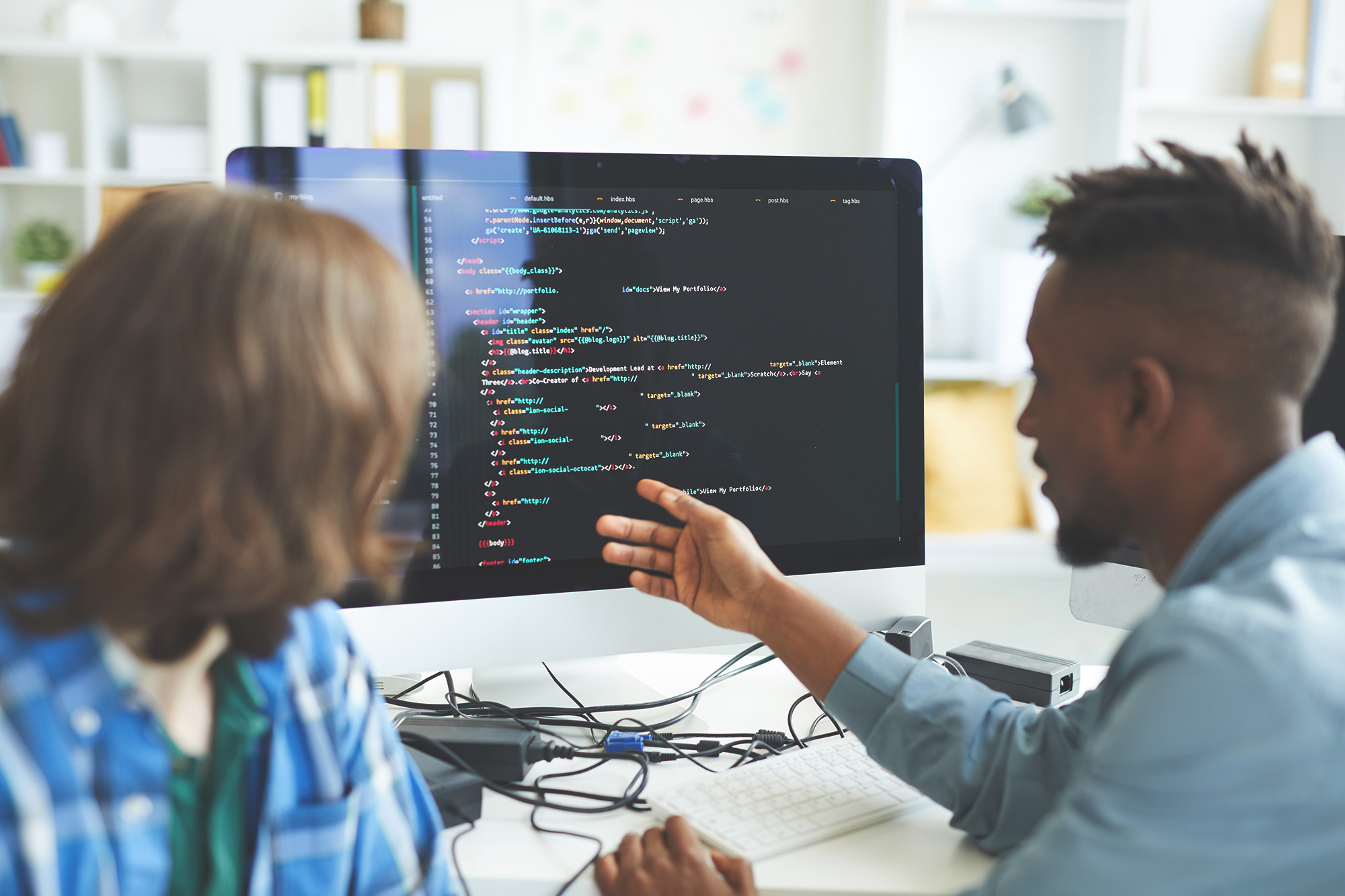 man showcasing code on monitor after conducting tech support