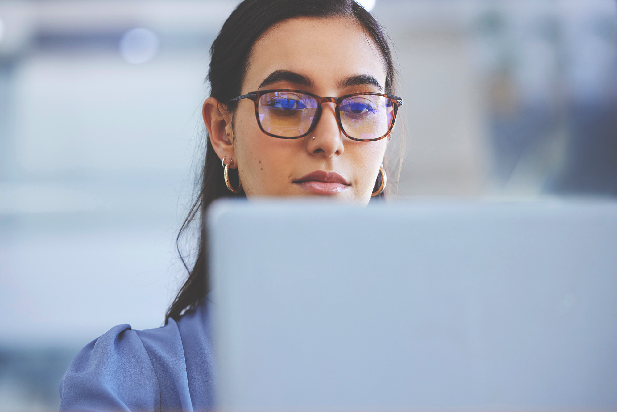 woman at her laptop looking at ppc ads