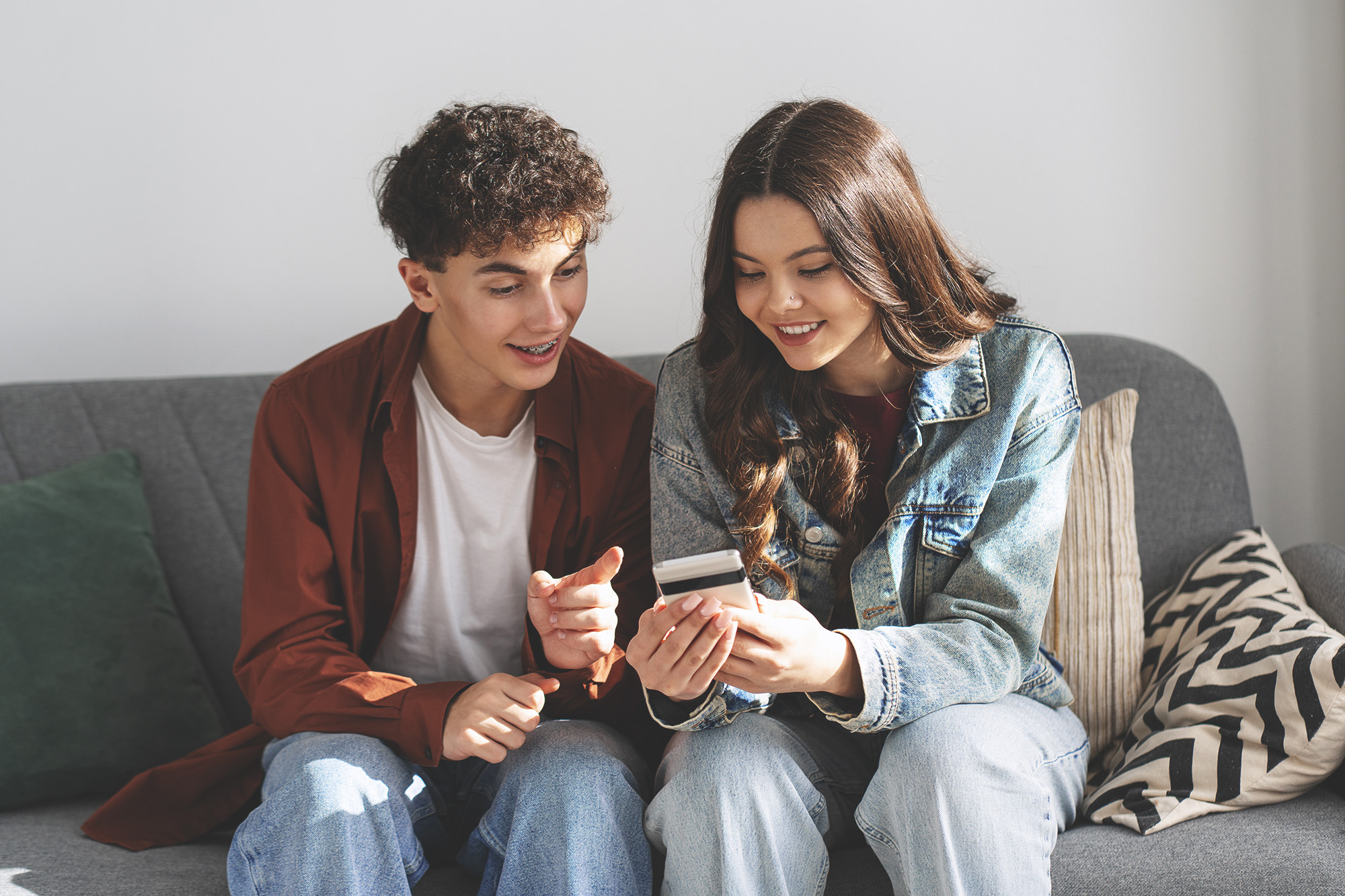 two young people buying products on social media