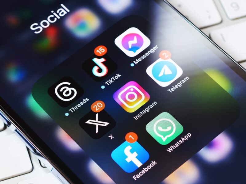 Social media icons in cluding tiktok and instagram on a phone