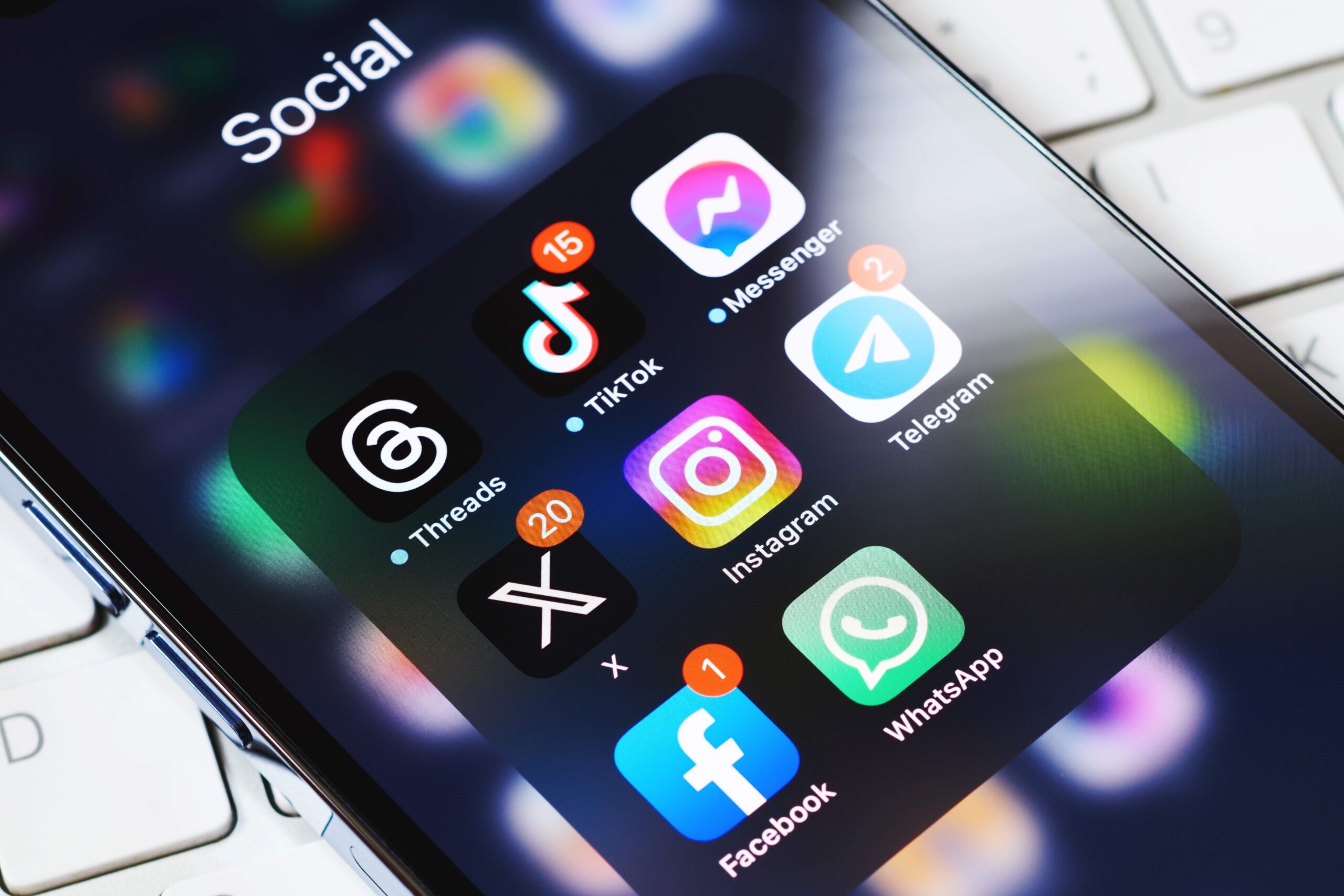 Social media icons in cluding tiktok and instagram on a phone