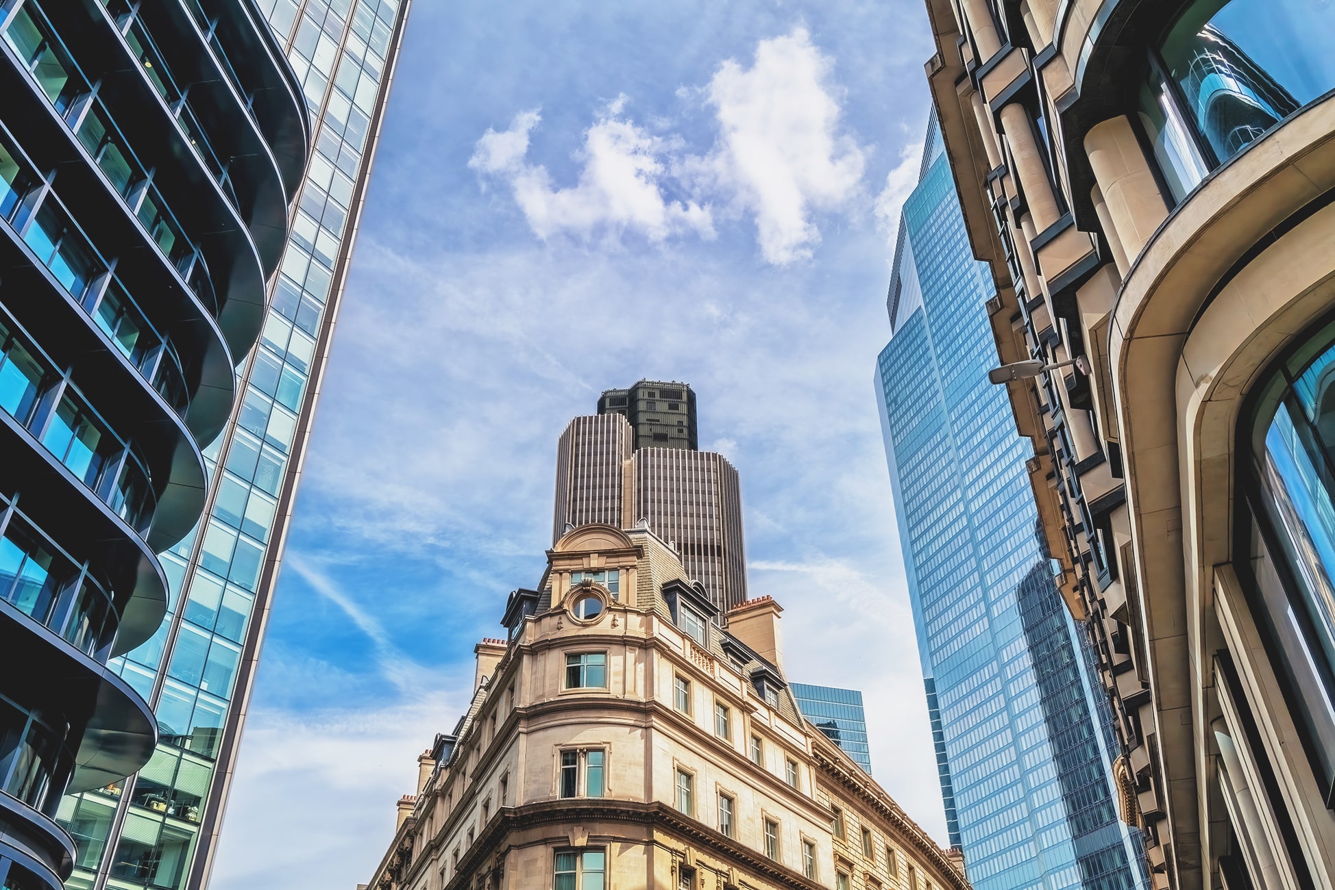 English city buildings with blue sky behind